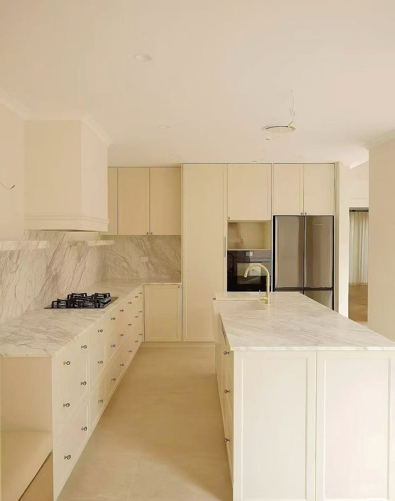 Custom white kitchen cabinetry by FormaMuse in Perth