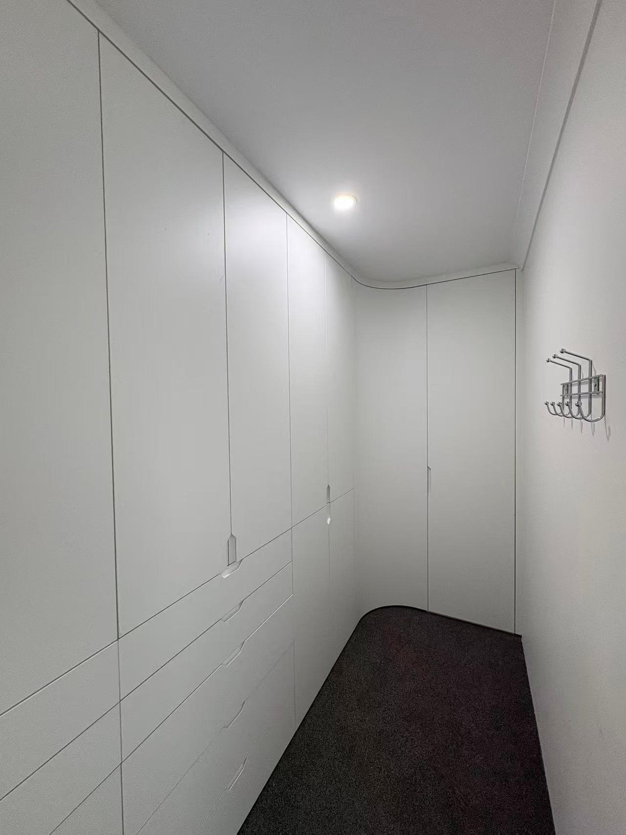 Full-height custom wardrobe storage by FormaMuse in Perth